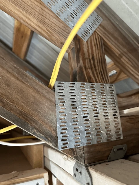 An example of loose electrical wires touching metal.